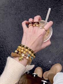 4pcs Bohemian Wooden Bead Layered Bracelets, Elephant Tassel Leaf Pendant Elastic Wristbands, Vintage Hand Jewelry - Brown - View 1