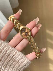 1件女款金色橢圓石英手錶，咖啡色錶盤，混合時標，適合日常配戴 - 金色 - 查看 2