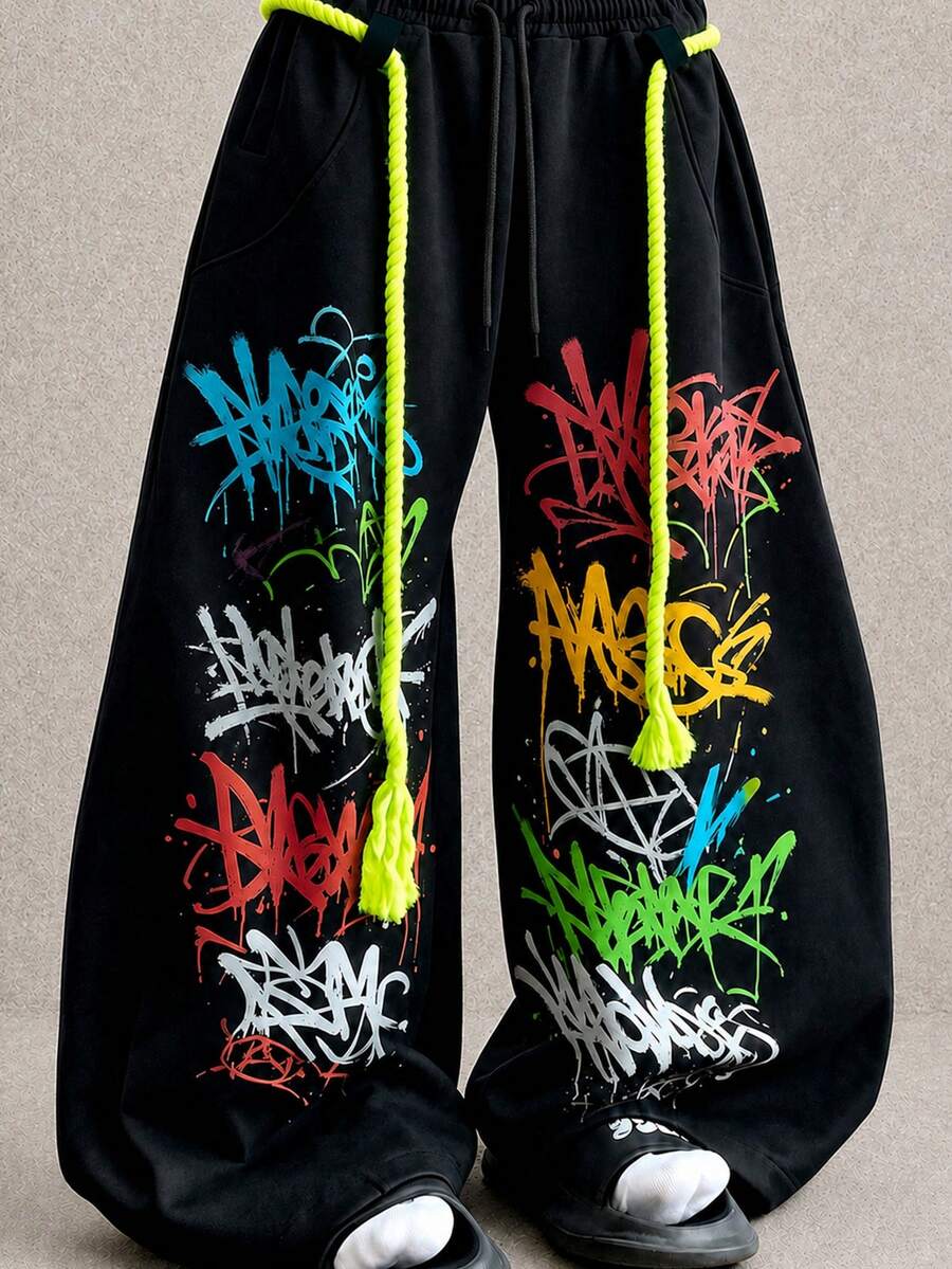 HEYKESON Men's Graffiti Print Loose Fit High Waist Sweatpants With Fluorescent Thick Drawstring, Street Style