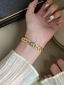 1件女款金色橢圓石英手錶，咖啡色錶盤，混合時標，適合日常配戴 - 金色 - 查看 5