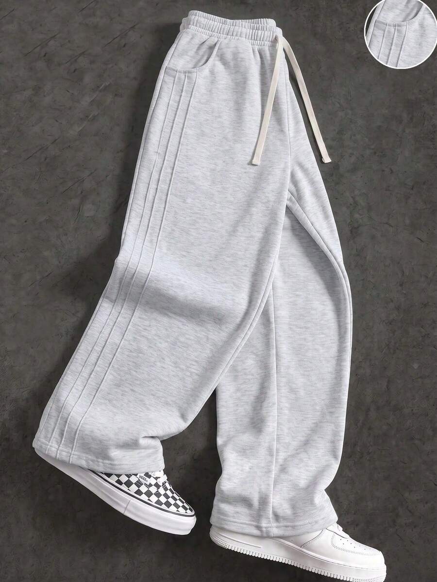 These Men's Casual Sports Pants Feature A Loose Straight-Leg Fit, Providing A Comfortable And Draped Feel. Suitable For Both Home And Outdoor Wear, They Also Make An Excellent Gift For Couples. The Pants Are Made From 100% Polyester Fabric. - Light Grey - View 1