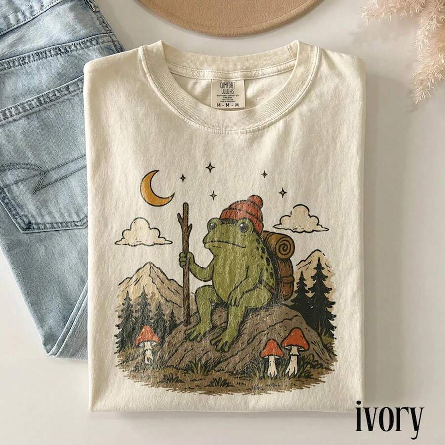 Vintage Frog Camping Graphic Tee, Forest Hiking Wildlife Shirt, Classic Outdoor Adventure Retro Top, Nature Gift Tee - Apricot - View 1