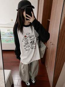 女士宽松休闲百搭印花插肩袖撞色卡通印花长袖T恤 - 黑與白 - 查看 2