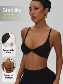 Women's Solid Color Removable Padded Twist Back Knit Sports Bra, Black - Black - View 1