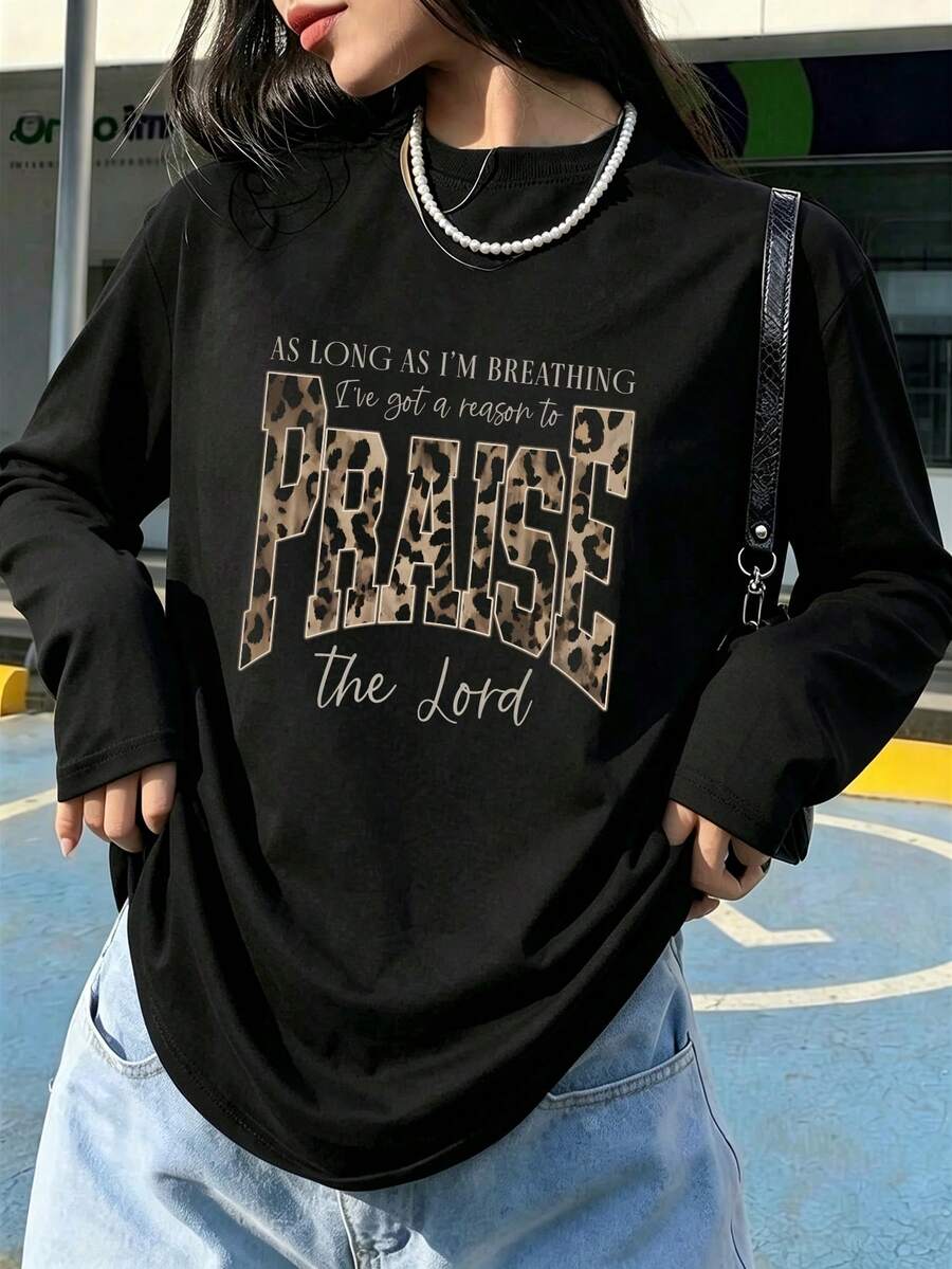Plus Size Women's Leopard Print "Praise The Lord" Faith Letter Graphic Long Sleeve T-Shirt, Medium Stretch Crew Neck Loose Fit Christian Casual Autumn Top - Black - View 1