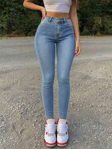 Light Blue Washed Mid-Waist Stretch Skinny Leg Jeans For Women, Leather Patch Waistband Slim Fit Curve-Enhancing Versatile Denim Long Pants - Medium Wash - View 1
