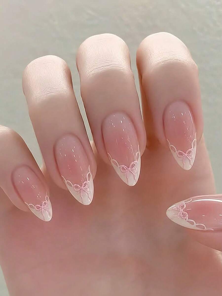 24片/組柔美甜美粉白漸層3D浮雕蕾絲蝴蝶結裙襬效果中長款杏仁尖形穿戴式美甲，附美甲工具，適合女孩與女性日常配戴、約會、生日派對，極簡性感女孩風美甲用品 - 彩色 - 查看 1