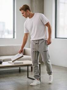 بنطال رياضي أساسي من الصوف الناعم من Fear Of God Essentials بلون رمادي فاتح، بنطال شارع فضفاض من الصوف الناعم للجنسين، ملابس كاجوال يومية متناسقة - رمادي فاتح مرقط - مشاهدة 5