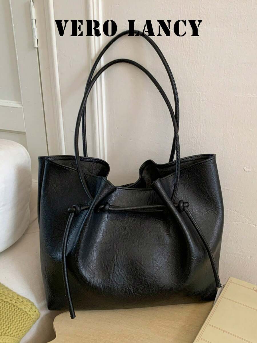 A Versatile Tote Bag With A Minimalist Commuting Style And A Relaxed Feel, Featuring A Large Capacity And Stylish Solid Color Texture.