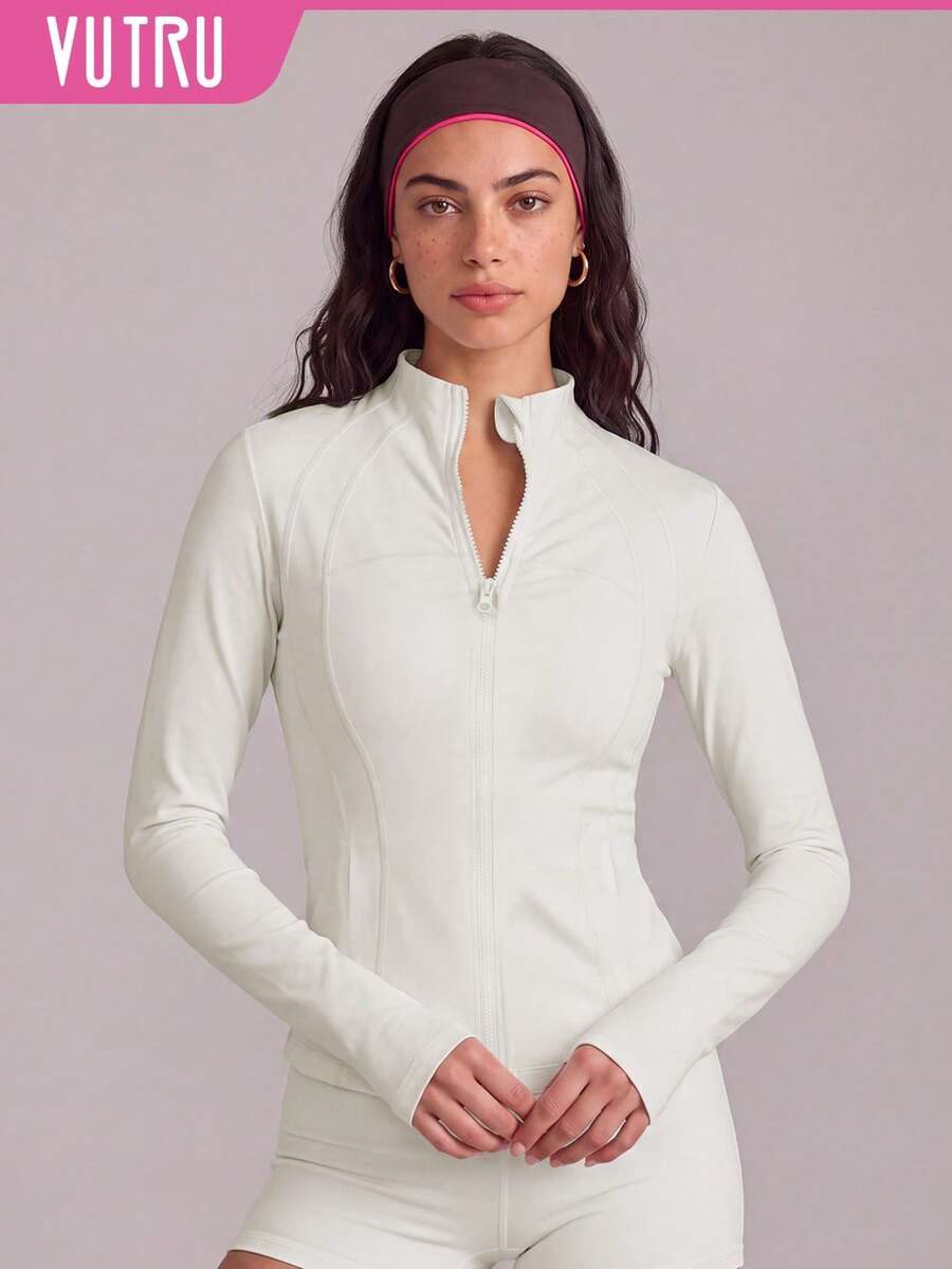 VUTRU Women's Slim Fit Dual Pocket Sports Jacket With Zipper, Thumb Holes And Small Stand Collar For Running And Fitness - Creamy White - View 1