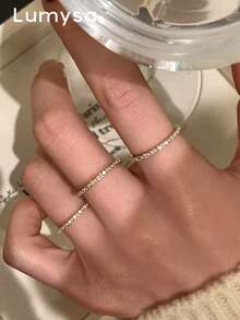 Set 3 buah cincin pita tipis mewah bertahtakan zirkonia kubik yang indah, cocok untuk pemakaian kasual sehari-hari wanita. - Yellow Gold - View 1