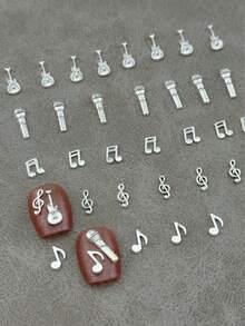 1 Pack Of 25 Metal Nail Accessories, Music Symbol Modeling And Guitar And Microphone Modeling, Three-Dimensional Effect Music Element Nail Decoration, Nail Supplies - Silver - View 1