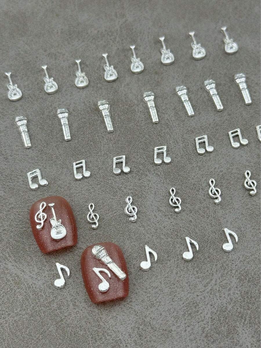 1 Pack Of 25 Metal Nail Accessories, Music Symbol Modeling And Guitar And Microphone Modeling, Three-Dimensional Effect Music Element Nail Decoration, Nail Supplies - Silver - View 1