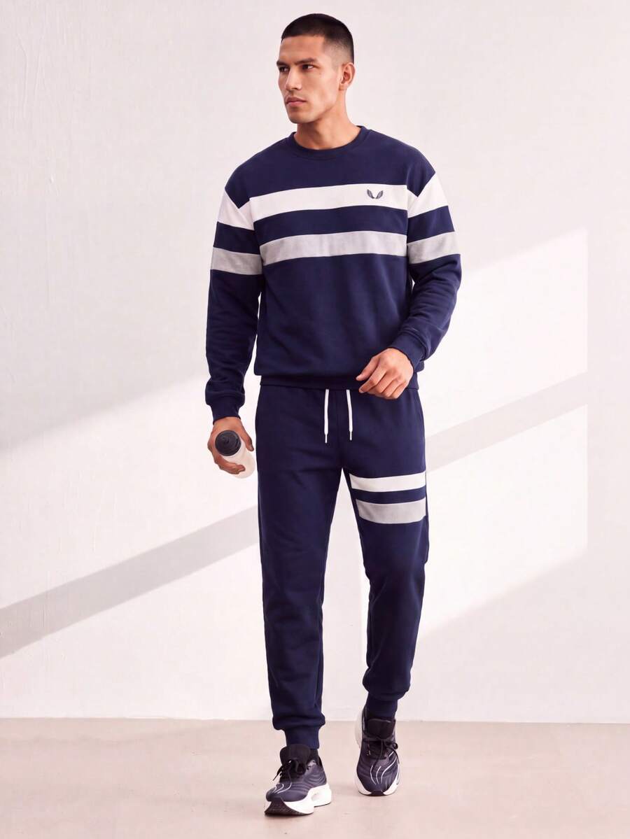 Driftmere Setelan Olahraga Pria Motif Sayap Bergaris, Kaos dan Celana Jogger Biru Tua dan Perak - Navy Blue - View 1