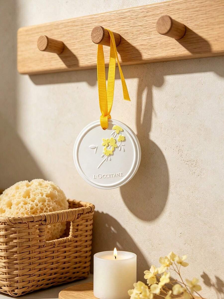L'Occitane Round White Scented Wax Hanging Tablet With Embossed Yellow Floral Pattern, Scented Wax Sachet Air Freshener For Wardrobe And Car, Elegant Holiday Gift LOCCITANE‑GIFT‑57 - Apricot - View 1