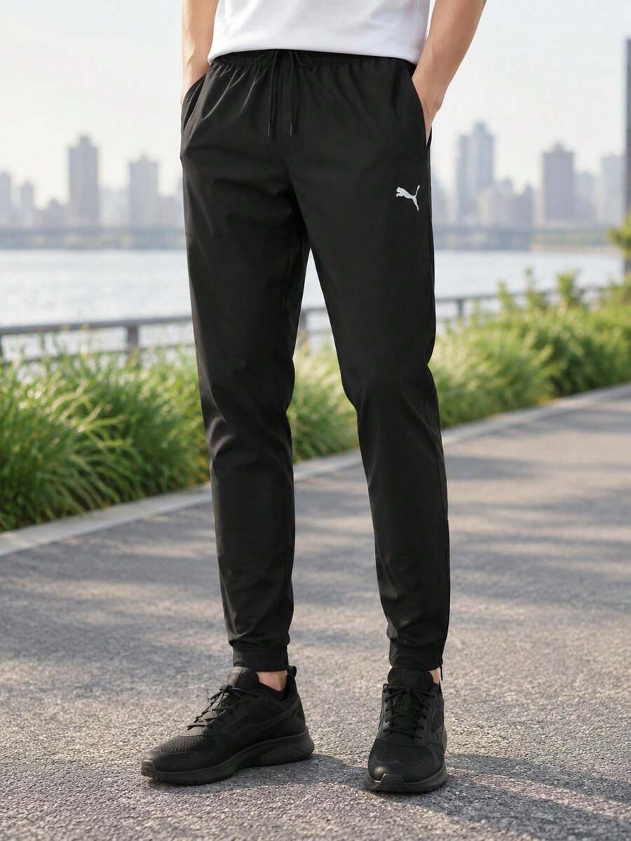 Puma Men's Soft Knit Long Pants TeamRISE Poly Training Pants Minimalist Lightweight Comfortable Soft 657390-03 - Black-puma White - View 1