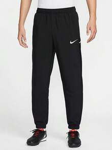 Nike Dri-FIT Men's Quick-Dry Tapered Knit Training Pants - Black - View 1