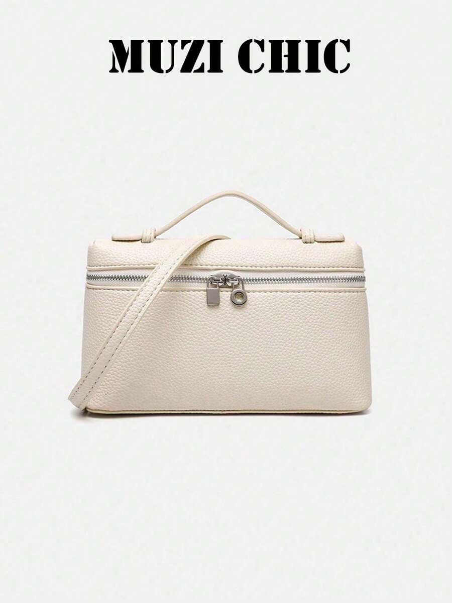 Handbag With A Clean, Structured Silhouette, Zipper Closure And Exquisite Lock Detail. Comes With A Short Handle And A Detachable Long Shoulder Strap, Supporting Multiple Carrying Styles. The Interior Space Is Well-Organized For Storing Personal Items, Making It A Versatile And Timeless Accessory For Daily Outings And Easy To Match With Various Outfits. - Ivory - View 1