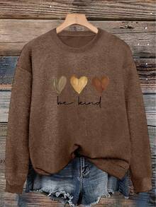 Plus-Size Women's Top Featuring A Three-Color Heart Pattern And The Slogan "Be Kind To Others"; Soft, Comfortable, Stylish, And Elegant. - Dark Ochre - View 1