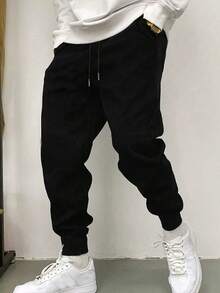 Men's Casual Lightweight Sports Pants, Slightly Loose Tapered Leg, Suitable For Home And Outdoor Activities. Made Of 100% Polyester, With Drawstring Waist For Easy Adjustment - Black - View 1