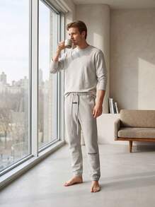 بنطال جوجر من الصوف الناعم بلون الشوفان الفاتح من Fear Of God ESSENTIALS SS22، بقصة فضفاضة مع رباط خصر وأساور مطاطية، بنطال ستريت وير للخروجات اليومية - لون الشوفان الفاتح - مشاهدة 8