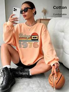 Women's Vintage 1976 Cassette Print Long Sleeve Pullover Sweatshirt, Casual Drop Shoulder Round Neck Top,  Fall Outfit - Hami Melon Orange - View 1