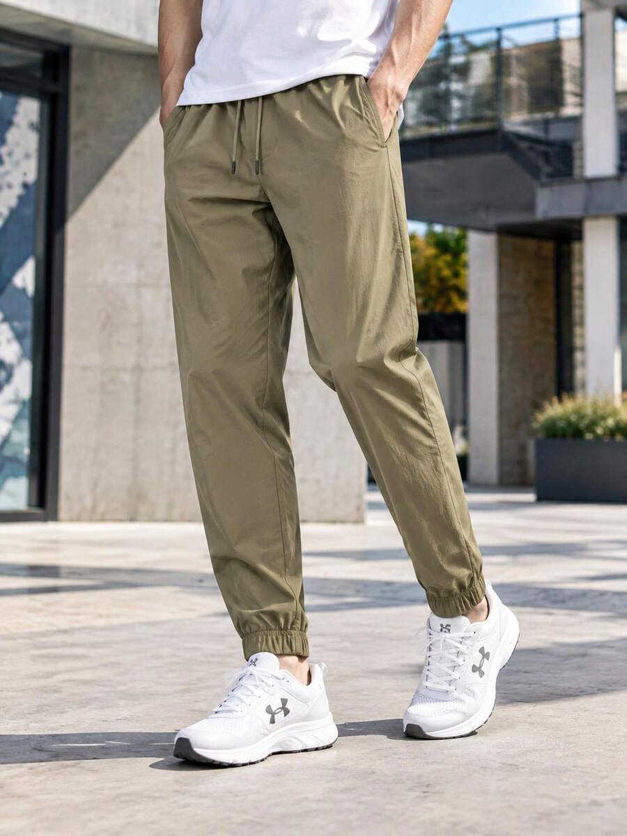Under Armour Men's UA Icon Woven Jogger Casual Pants, Loose Fit Comfortable Minimalist Training Pants 6000663-251 - Quartz Gray - View 1