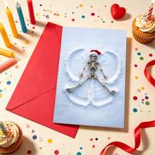 OBOVAY Skull Snow Angel Christmas Greeting Card, Funny Skeleton Wearing Santa Hat Making Snow Angel On Snowy Ground, Cool Gothic Style Holiday Design White Snow Background Unique Black Humor Style Greeting Card - A - View 1