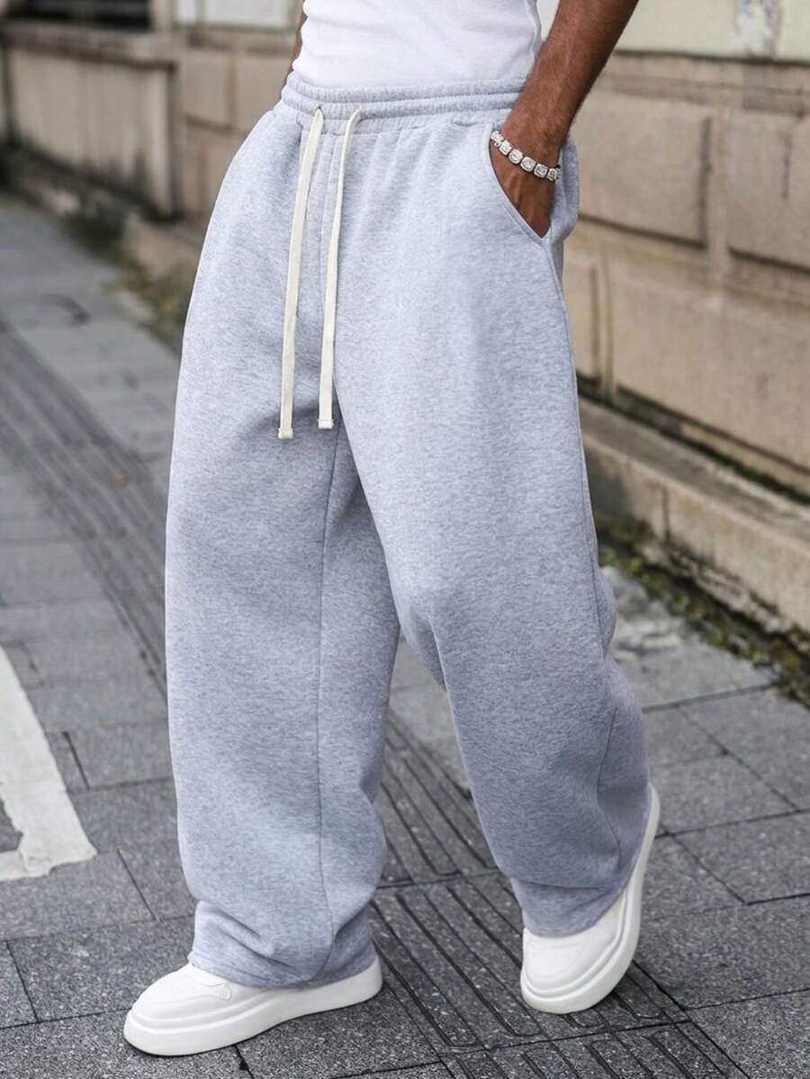 Men's Loose Casual Sports Pants, Featuring Simple Solid Color Wide Leg Design, Drawstring Waist, Large Pockets, Suitable For Daily Walking, Work, Travel And Other Occasions. Made Of 100% Polyester Fabric, Lightweight Wide-Leg Casual Pants Suitable For All Seasons.