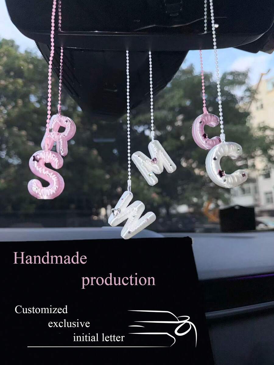 You Can Make Your Own White Diamond Letter Car Rearview Mirror Hanger. It Features A Silver Bead Chain Design, With An Elegant Shiny Cream Texture. It Can Be Easily Hung On The Car's Rearview Mirror And Is A Charming Interior Decoration For Your Car.