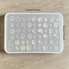 1件多尺寸小花矽膠美甲壓花模具，平板式佈局含大小五瓣花、多層花瓣與細小花朵壓紋溝槽，柔軟可彎曲矽膠易壓印且完整脫模，不撕裂不黏膠，溝槽深度均勻適合填入美甲膠打造3D立體花瓣紋理，平板表面無毛邊殘渣，易擦拭清潔重複使用，薄板可微彎貼合指甲弧面進行造型，適合美甲店量產溫柔風3D花卉美甲 - 彩色 - 查看 10
