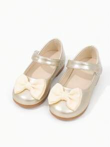 Flickors glänsande Mary Jane-ballerinaskor i guld och beige med ribbad rosett och kardborreband, lämpliga för födelsedagspartyoutfits - Guld - Visa 1
