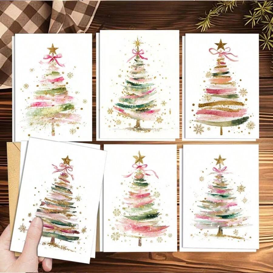 مجموعة بطاقات تهنئة شجرة عيد الميلاد بألوان مائية خضراء فاتحة 24/12 قطعة، 6 تصاميم مختلفة مرسومة يدويًا مع أظرف من ورق الكرافت، تصميم نجوم وثلج وفيونكة بمسحوق ذهبي، بطاقات رسائل تهنئة مكتوبة يدويًا لعيد الميلاد لهدايا العطلات - أطقم - مشاهدة 1