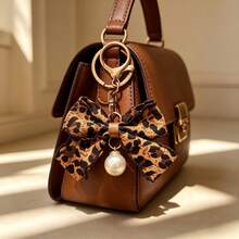 1pc Leopard Print Bow Keychain, Car Pendant, Hair Accessory, Casual Bohemian Party Cute Street Elegant Zinc Alloy, Suitable For All Seasons - Coffee Color - View 1