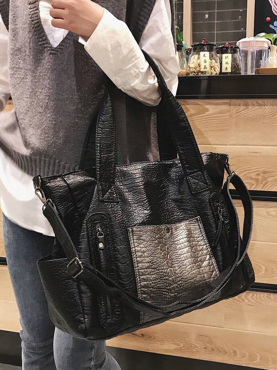 黑色 PU 皮革柔軟鱷魚紋大容量托特包，多口袋設計，附肩背帶與斜背帶，可容納 16 吋筆電與文件夾，適合上班、購物、旅行、度假、休閒，適合喜歡大包款的顧客