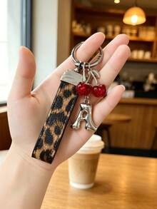 26 Alphabet Letter Keychain Pendant Creative Leopard Print PU Rope Key Strap, Cherry Charm, Car Keychain Pendant, Bag Charm Accessory, Key Decoration Accessory, 26 Letters To Choose From, Meaningful Gift For Family And Friends On Holidays - Brown - View 1