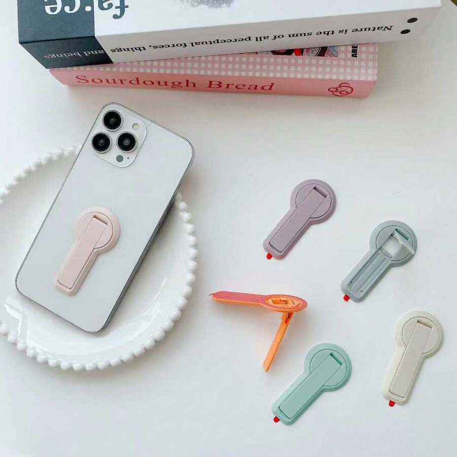 1pc Solid Color Invisible Foldable Phone Stand, Self‑Adhesive 360° Rotation Desktop Back Paste Portable Phone Holder For Smartphone - Multicolor - View 1