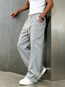 Quần nỉ thể thao nam màu xám dáng rộng ống rộng, quần track pants phối sọc bên hông cùng tông, cạp chun dây rút, túi hai bên, gấu mở - Màu Xám nhạt - Xem 6