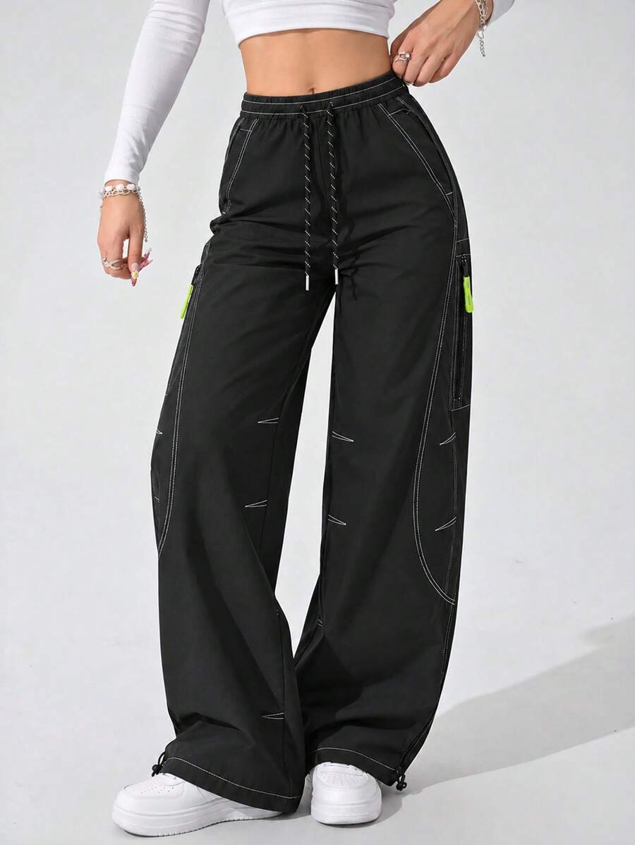 Women's Black Cargo Pants With Wide Leg, Drawstring Elastic Waist, Contrast Stitching, Zipper Pockets And Adjustable Hems - Black - View 1