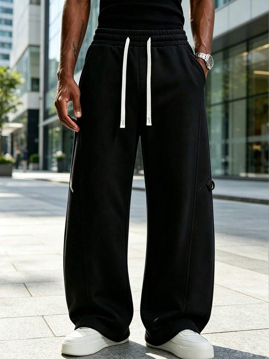 Men's Loose Fit Sports Pants, Wide Leg Casual Jogging Pants | High Waist Drawstring, 2 Deep Pockets, Open Hem, Loose Joggers, Streetwear Style - Black - View 1