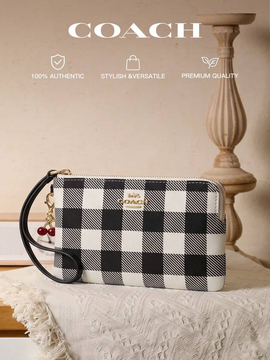 Coach 經典帆布條紋圓角拉鍊手拿包