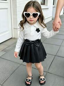 2pcs Baby Girl Sweet Elegant Outfit: White Ribbed Polo Neck Floral Sweatshirt Top + 3D Bow Pleated Faux Leather Mini Skirt Set - White - View 1