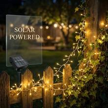 Christmas Halloween Warm Color Solar Powered Firecracker Fairy String Lights, Available In 5M100LED, 8M200LED, 11M300LED Multiple Sizes To Choose From. The Clustered Light Beads Simulate The Shape Of Firecrackers, With A Tight And Three-Dimensional Arrangement. When Lit, The Soft Warm Light Spreads And Radiates, Creating A Strong Atmosphere Like Scattered Starlight On Earth. Solar Energy Storage Design, Absorbing Sunlight During The Day To Store Power - Solar Firecracker String Lights - View 4
