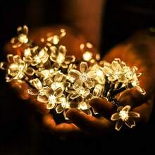 Outdoor Solar Powered Cherry Blossom Fairy Lights, 100 LED 3D Flower Shaped String Lights, Waterproof And Sun-Resistant, Solar Powered , Multiple Lighting Modes Switchable. 12m Long Cable Convenient For Wrapping Greenery, Fences, Tree Trunks, Suitable For Yard, Patio, Lawn Decoration, Wedding, Proposal Scenes, Social Media Photo Spots, Creating Warm And Romantic Outdoor Atmosphere Decorative String Lights. - Solar Cherry Blossom Lights - View 7