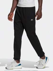 Celana Jogger Rajut Longgar Warna Hitam untuk Lari dan Latihan Pria dari adidas - Hitam - View 1