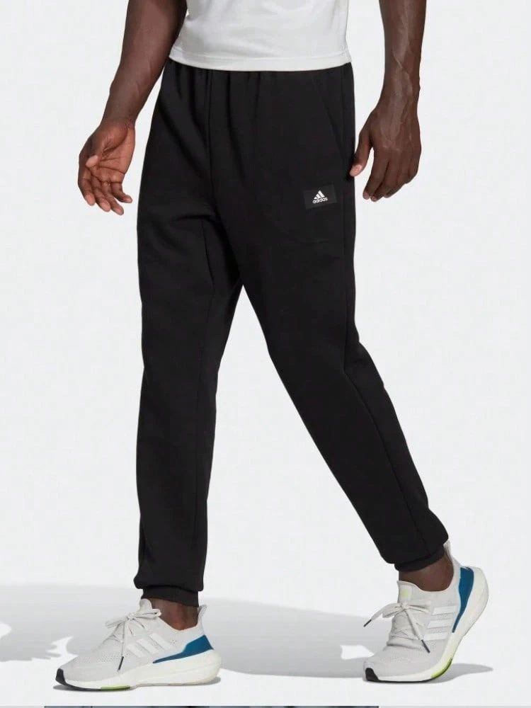 Celana Jogger Rajut Longgar Warna Hitam untuk Lari dan Latihan Pria dari adidas - Hitam - View 1