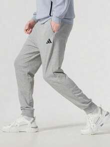 Adidas Men's Spring 2026 New Casual Sports Tapered Sweatpants, Comfortable JE3855 - Grey - View 1