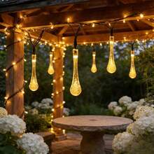 Warm Light Solar Water Drop String Lights, Available In 5M20LEDs, 7M50LEDs, 12M100LEDs Three Sizes, Exquisite Transparent Water Drop Shape, Warm Light Radiates From Inside The Water Drops, Soft Light Diffuses, Elegant And Fresh Style. Solar Powered, Automatically Stores Sunlight Energy During The Day, Automatically Turns On At Night, No External Power Supply Needed, Eliminates Wiring Hassle, Easy Hanging Installation. Multiple Light Dynamic Modes, Soft And Soothing Warm Light - Solar Water Drop String Lights - View 9