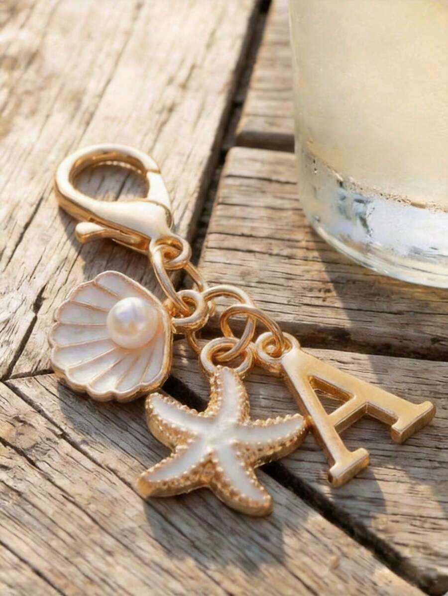 Llavero de letra dorada estilo bohemio, decoración de concha & estrella de mar, accesorio de vacaciones en la playa con letras A-Z, adecuado para mochila, billetera, colgante de bolso - Multicolor - Ver 1