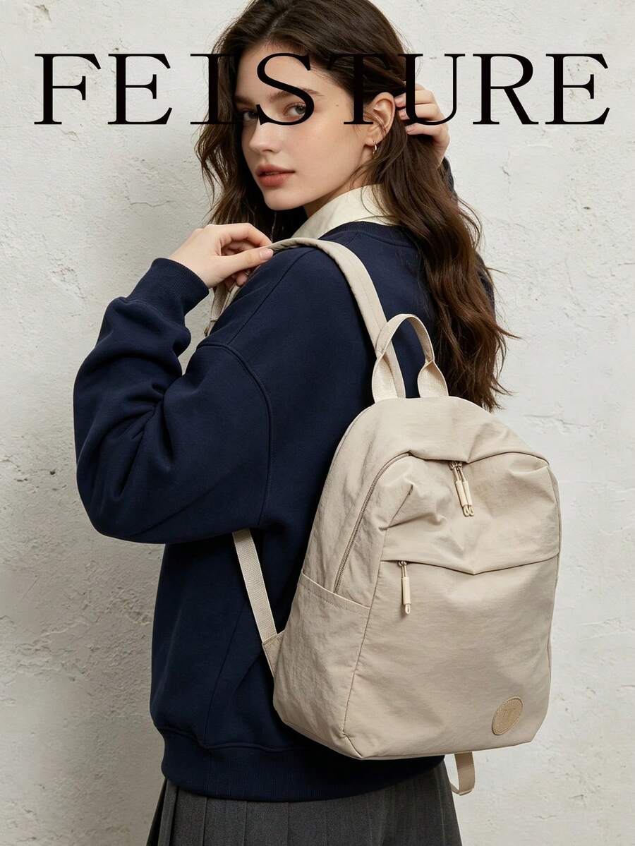 1 件 FEISTURE 纯色轻质尼龙防水背包，大容量休闲书包